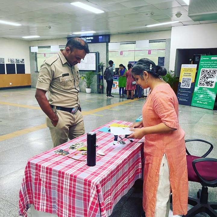 Interacting with police personnel at Cubbon Park Metro station